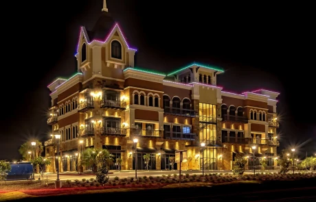 Building illuminated with custom permanent LED lighting, showcasing app-controlled, energy-efficient lighting solutions.